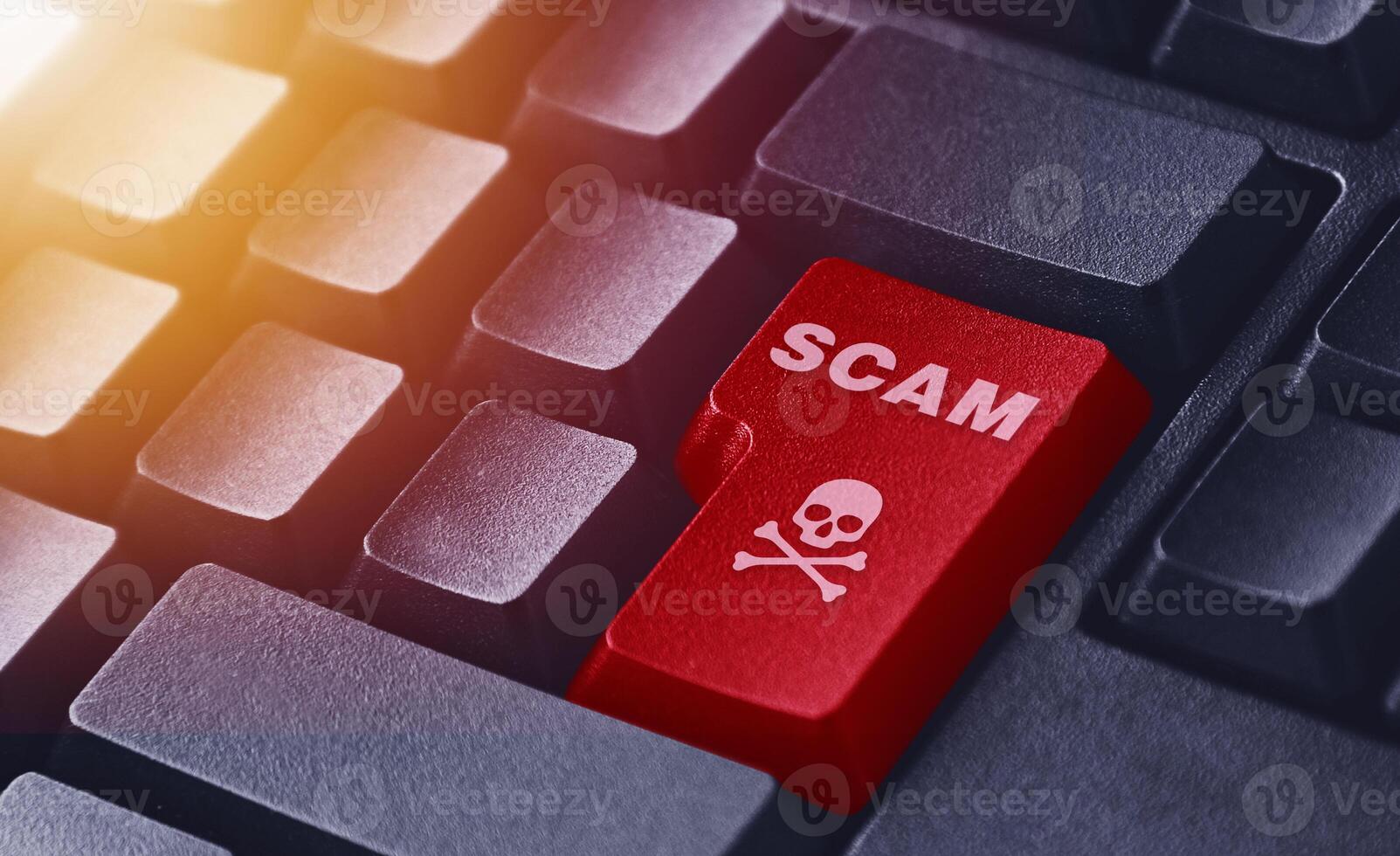 The scam button illustration on a black keyboard. Cybercrime button illustration photo