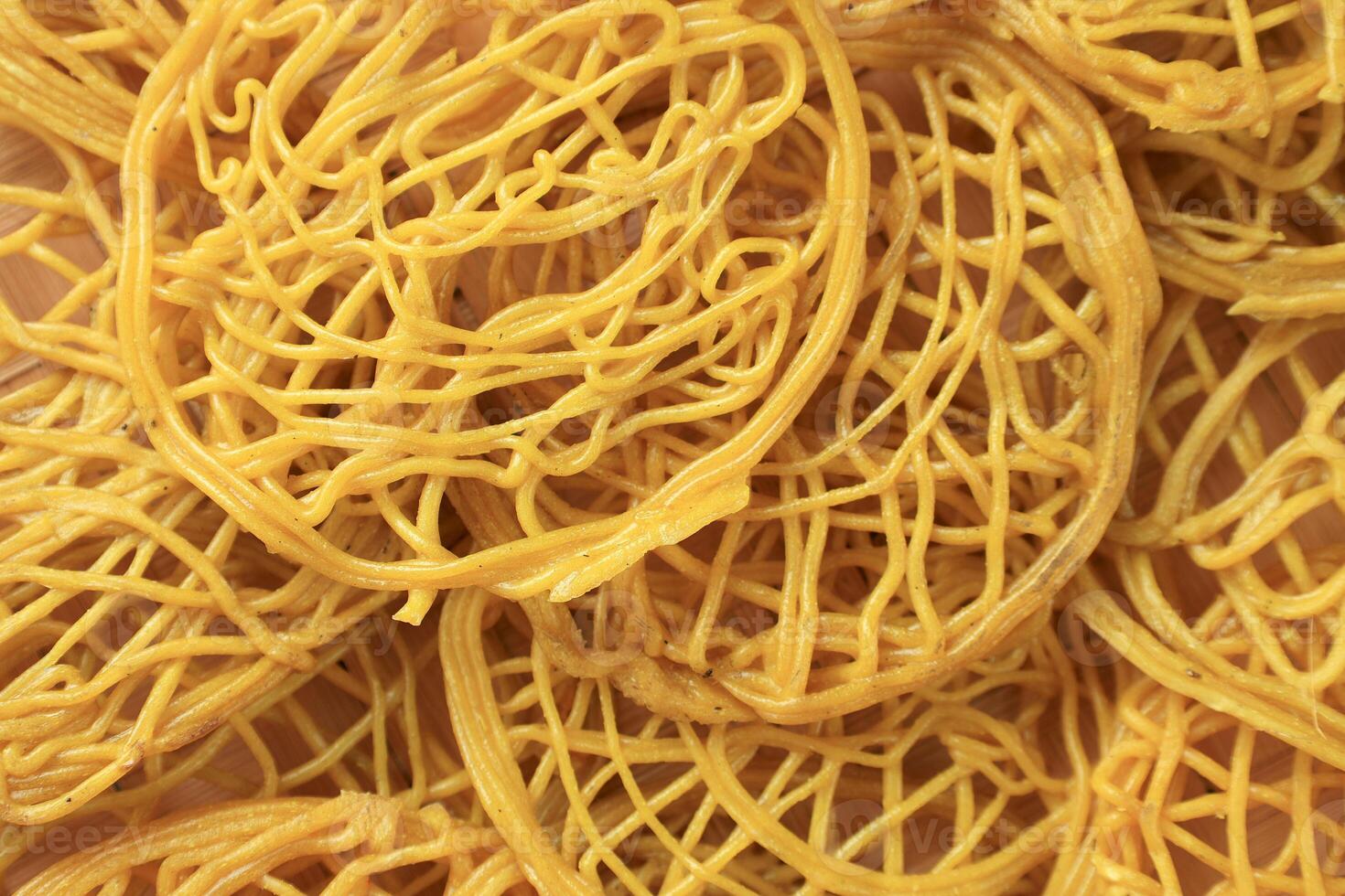 Texture of Kerupuk Mie Kuning, Dried Raw Yellow Noodle Crackers photo