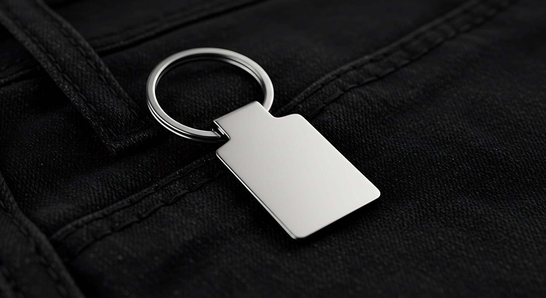 A keychain with a square metal tag on it photo
