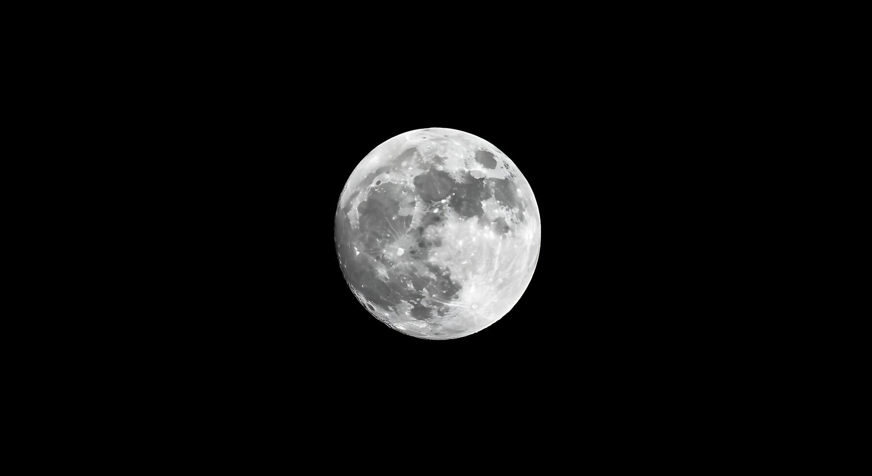 The moon is seen in the dark sky photo