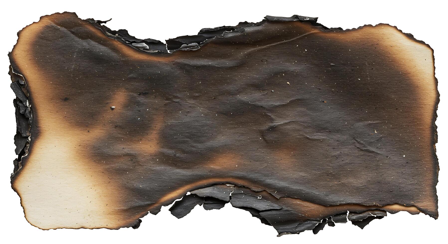 A burnt piece of paper on a white background photo