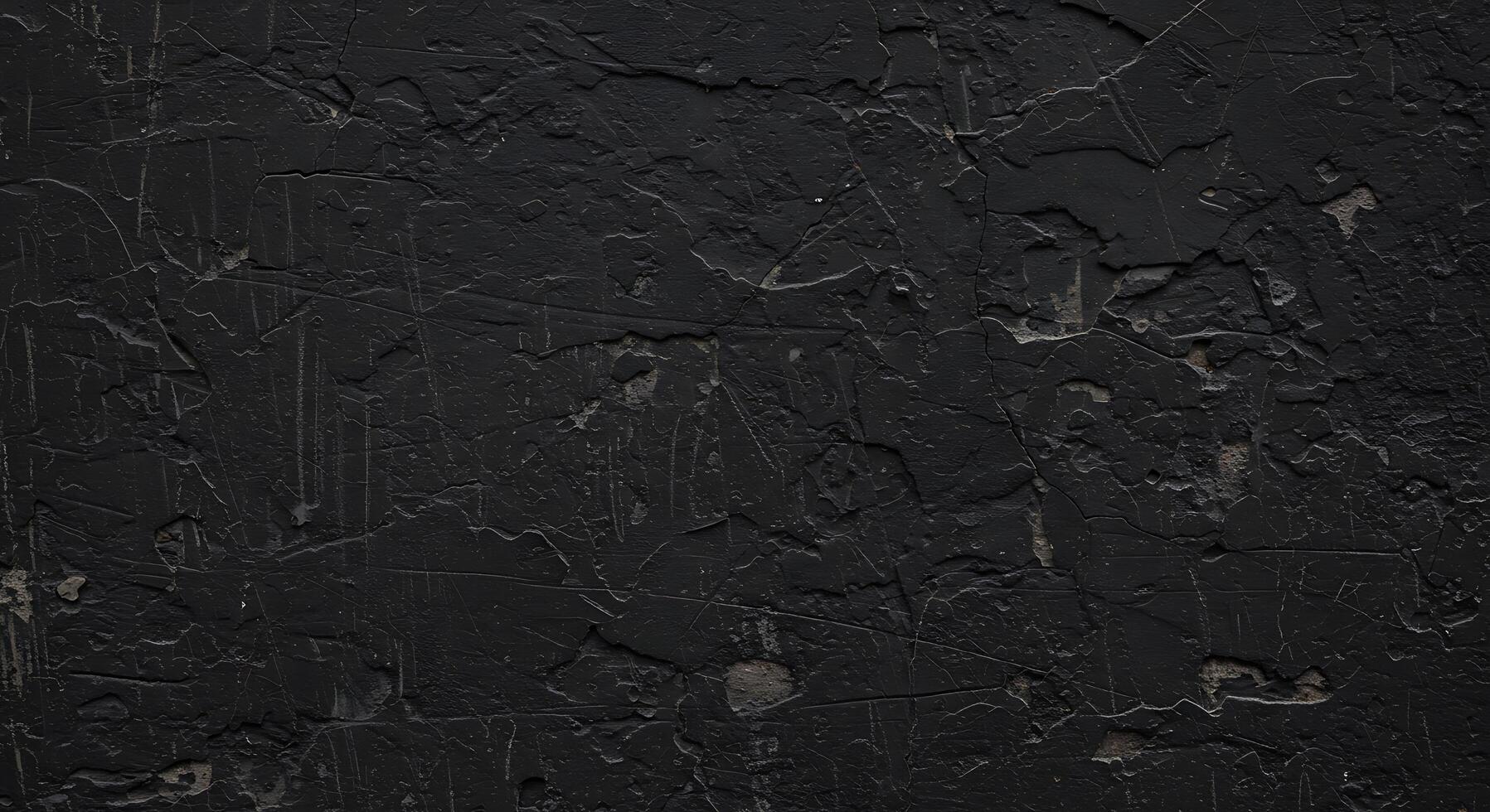 A black wall with some paint on it photo