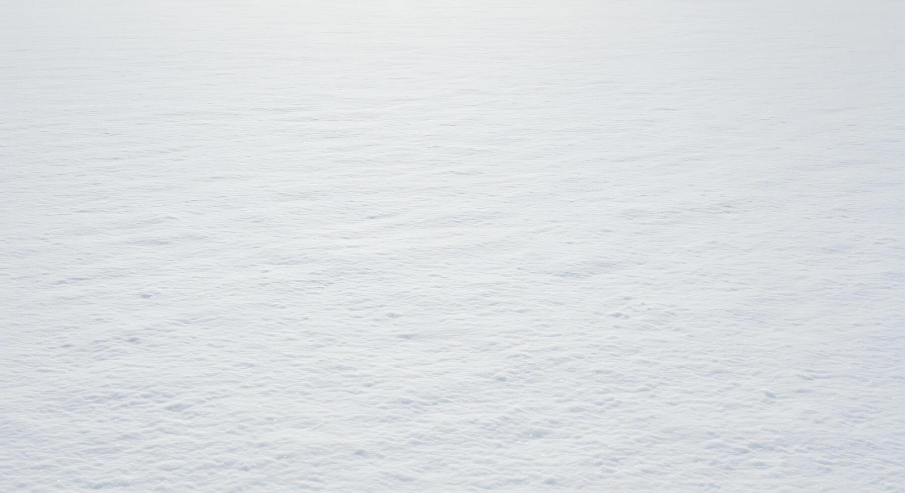 A person standing on a snow covered field photo