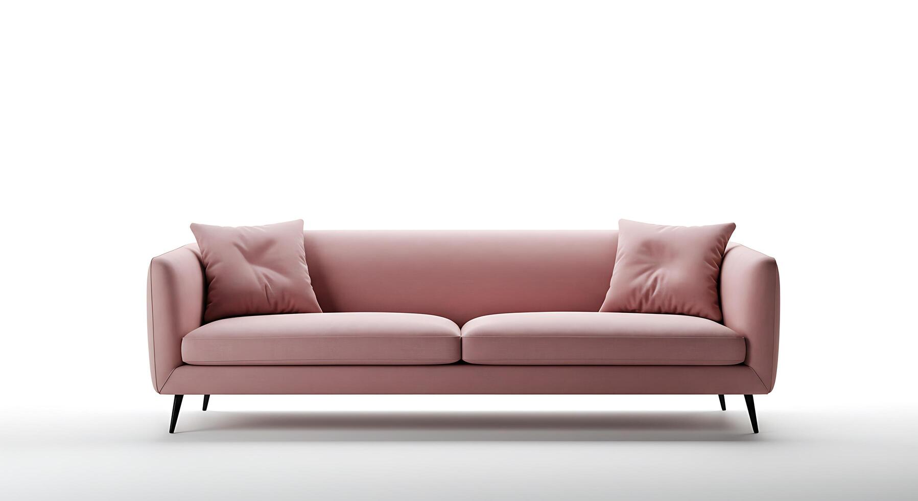 A pink sofa with two pillows on it photo