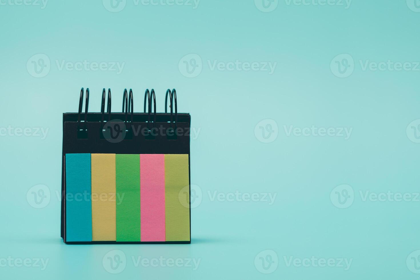 Colorful Sticky Notes Arranged on a Blue Background photo