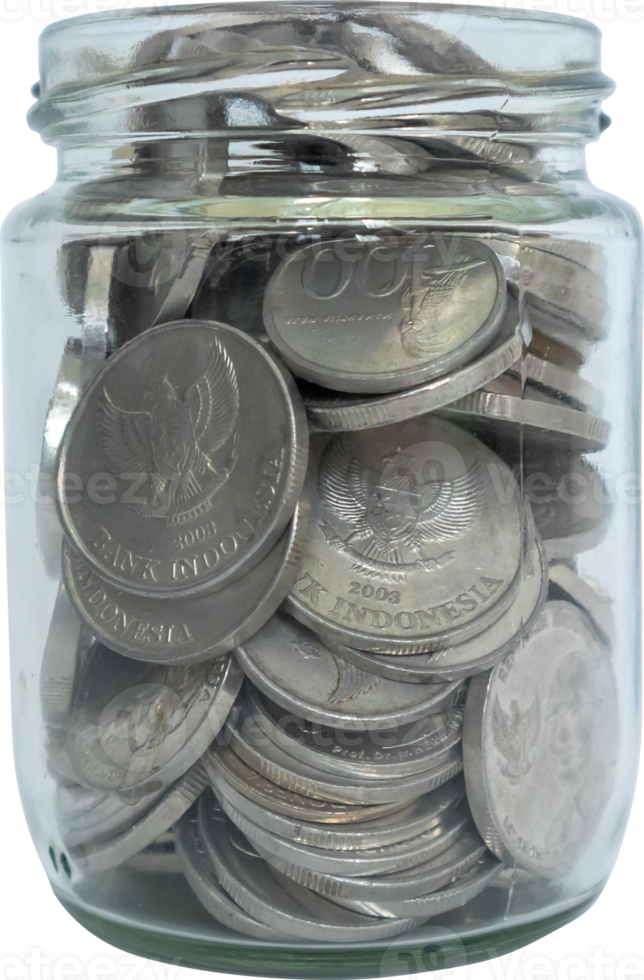 Coins in a glass jar. Save money. png