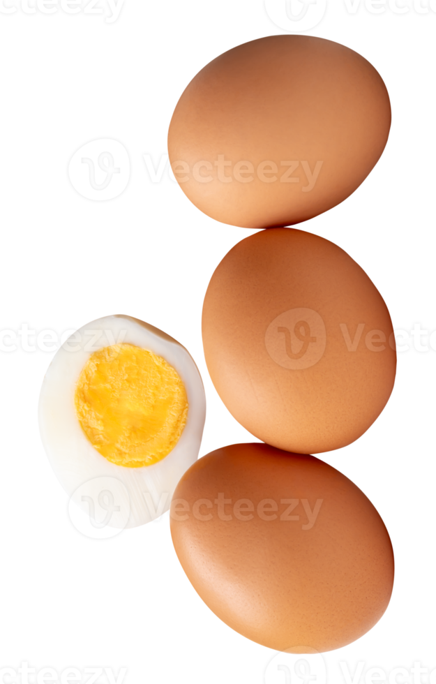 A stack of raw brown chicken eggs and cooked or boiled chicken egg with egg yolk in half isolated in file format png