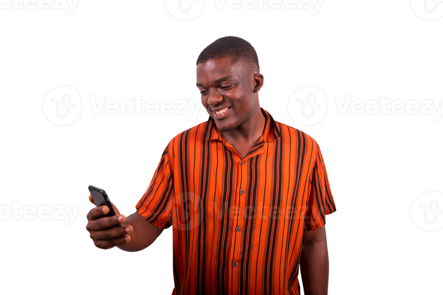 A young African man uses his smartphone and smiles, model isolated on transparent background png