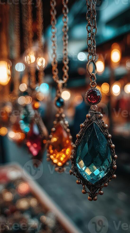 Colorful gemstone necklaces displayed in a market during twilight with warm lights in the background photo