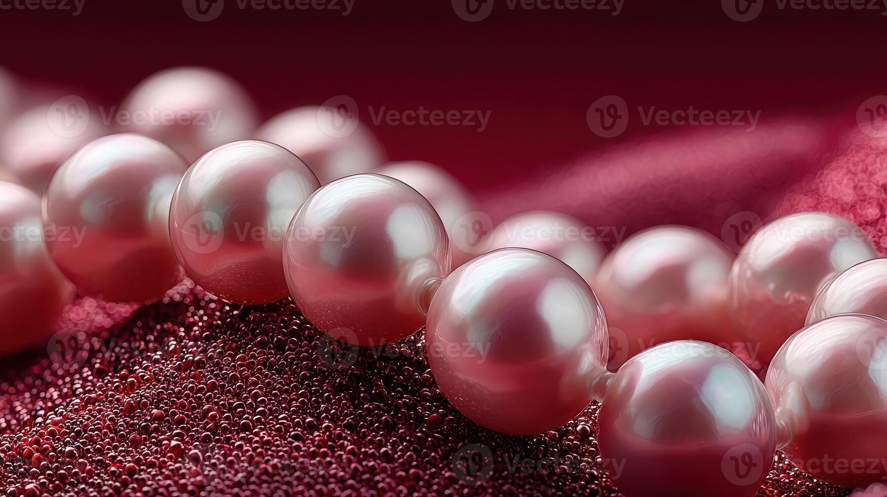 Stunning close-up of lustrous pink pearls resting on a textured maroon surface in soft light photo