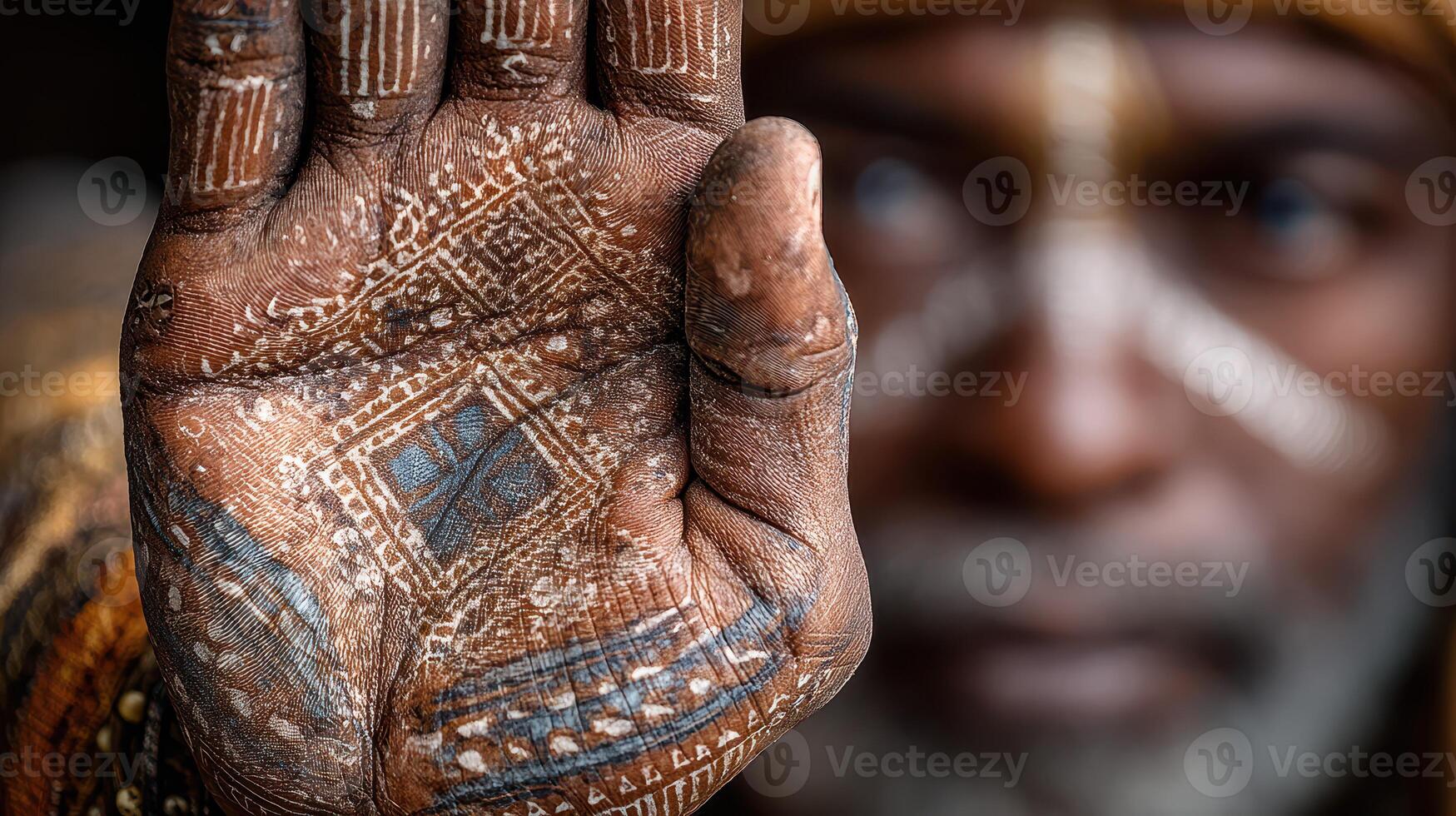 Traditional hand art showcased by a skilled artisan in a cultural setting during daylight hours photo