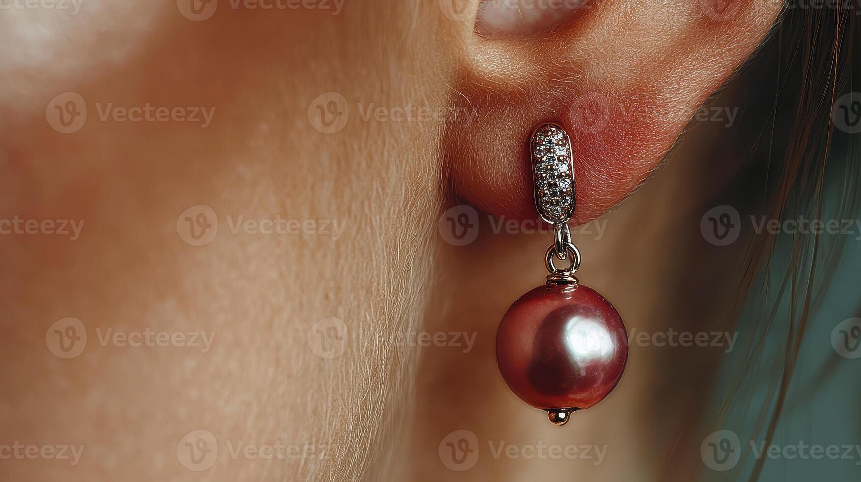 Elegant pearl earring with subtle sparkle showcased in close-up view against a blurred background photo