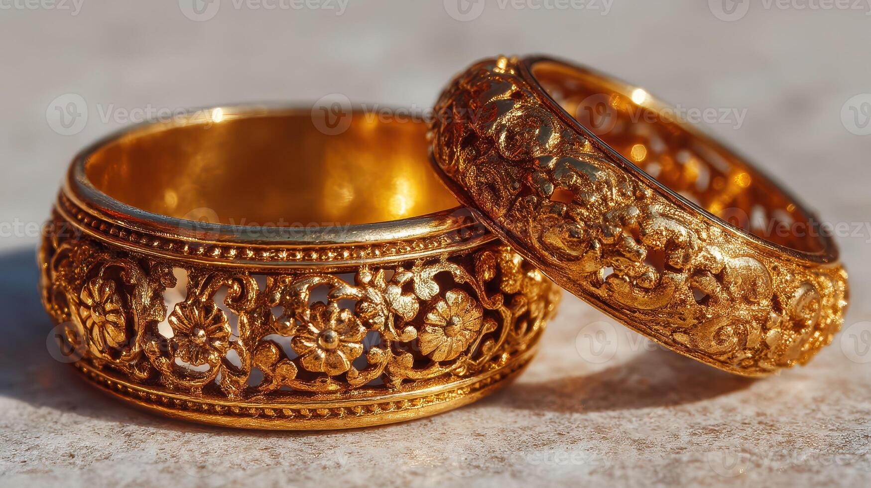 Intricate gold rings with floral designs displayed in natural light showcasing craftsmanship and elegance photo