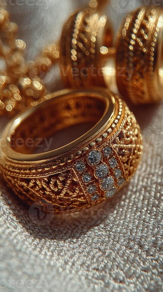 Intricate gold ring adorned with gemstones displayed on soft fabric background at a jewelry showcase photo