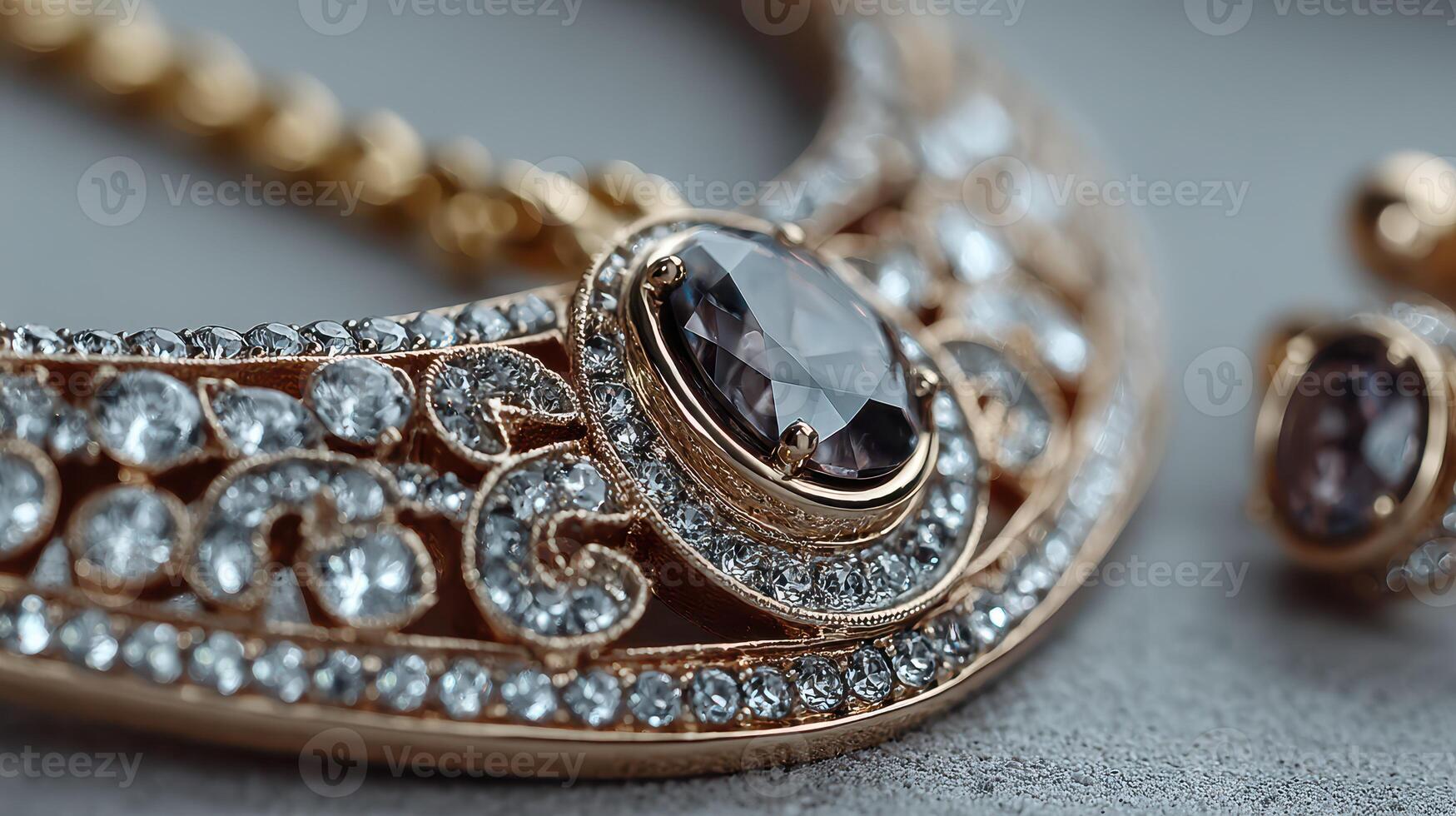 Elegant vintage jewelry featuring intricate designs and sparkling gems displayed on a textured gray background in soft lighting photo