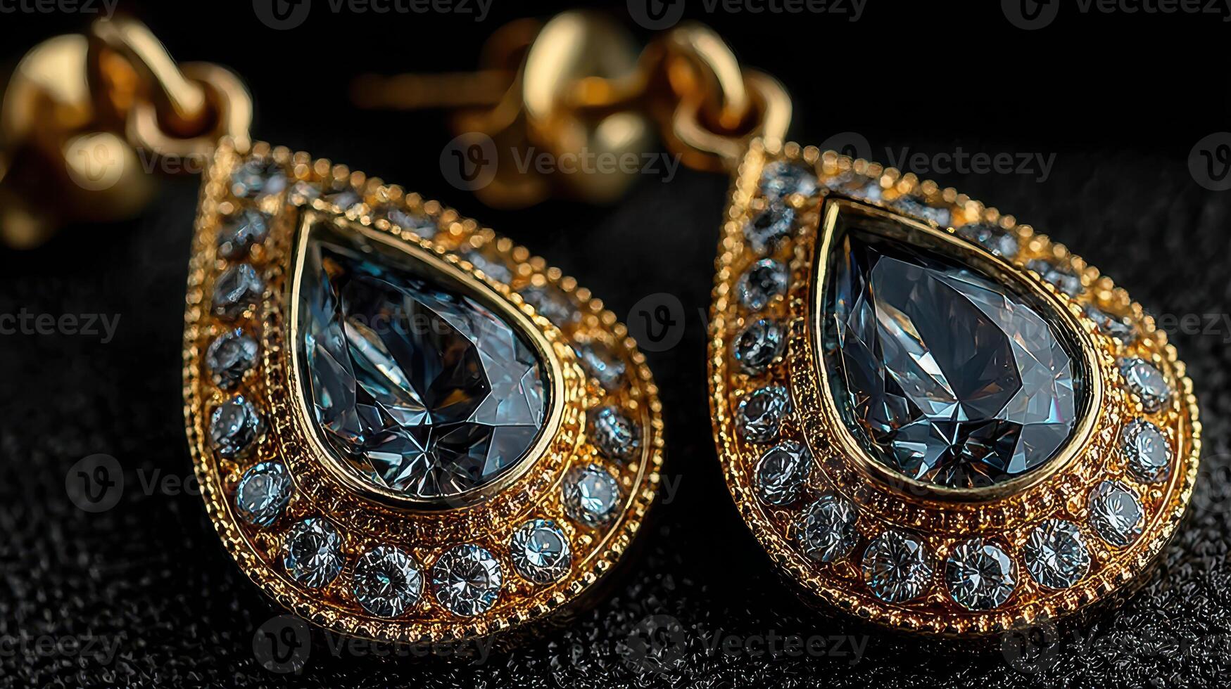 Elegant golden earrings with blue gemstones displayed on a dark background in a close-up view photo
