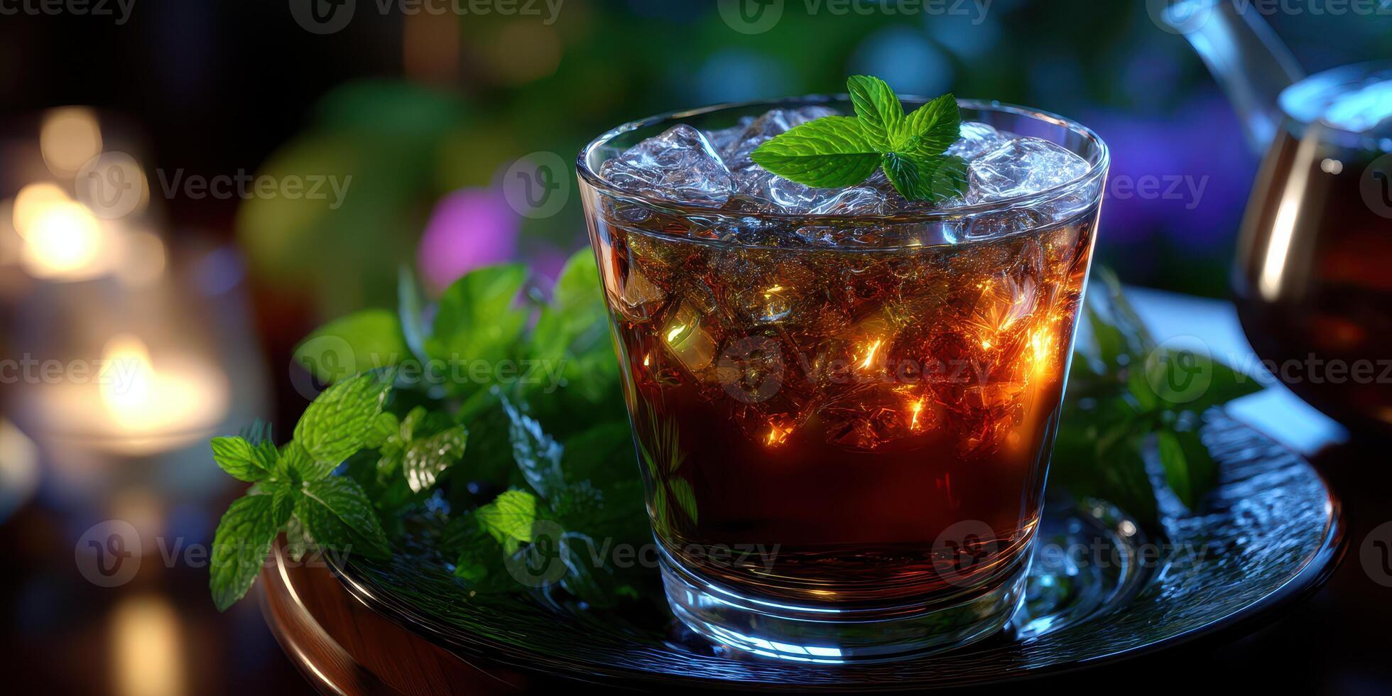 Refreshing iced drink garnished with mint leaves served on a wooden table in a cozy, dimly lit outdoor setting photo