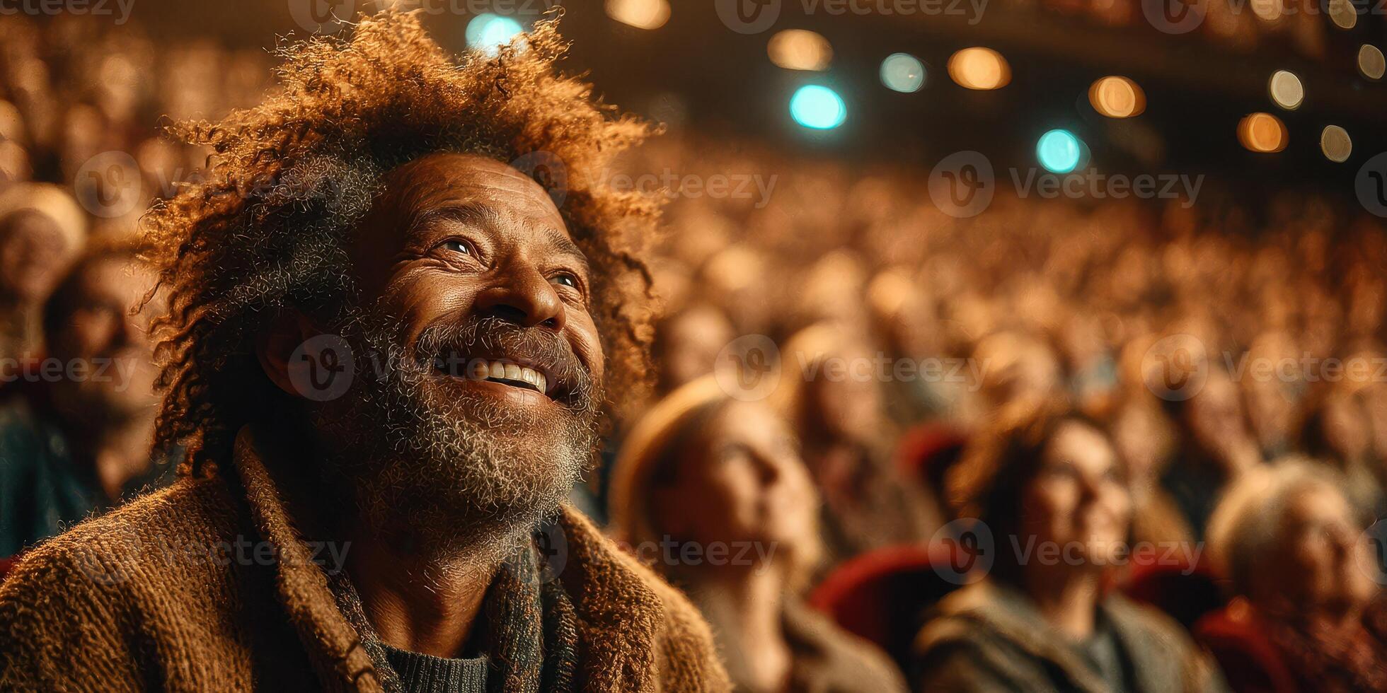 Smiling man enjoys live performance in crowded theater during evening show photo