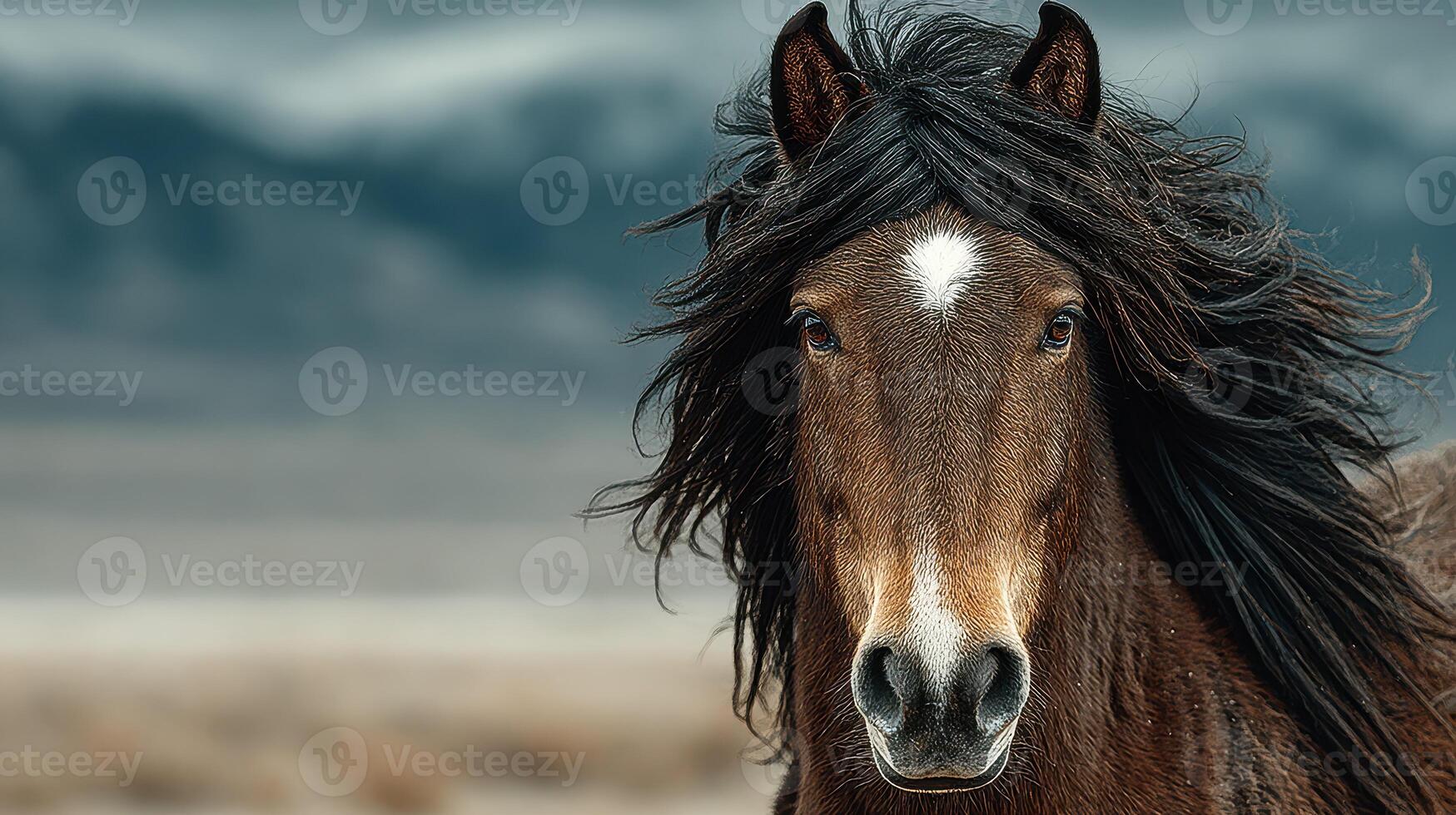 Majestic brown horse standing in a vast landscape with flowing mane under cloudy sky photo