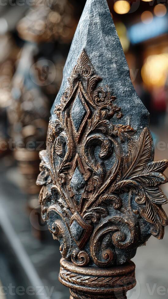Ornate metalwork detail showcasing craftsmanship in an urban setting during daylight photo