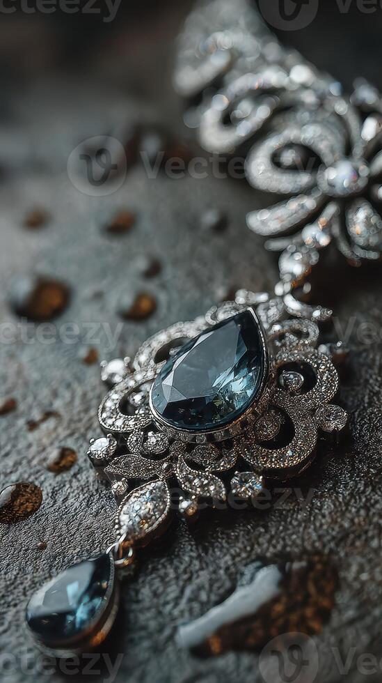 Elegant silver jewelry with blue gemstones displayed on a textured surface in soft lighting photo