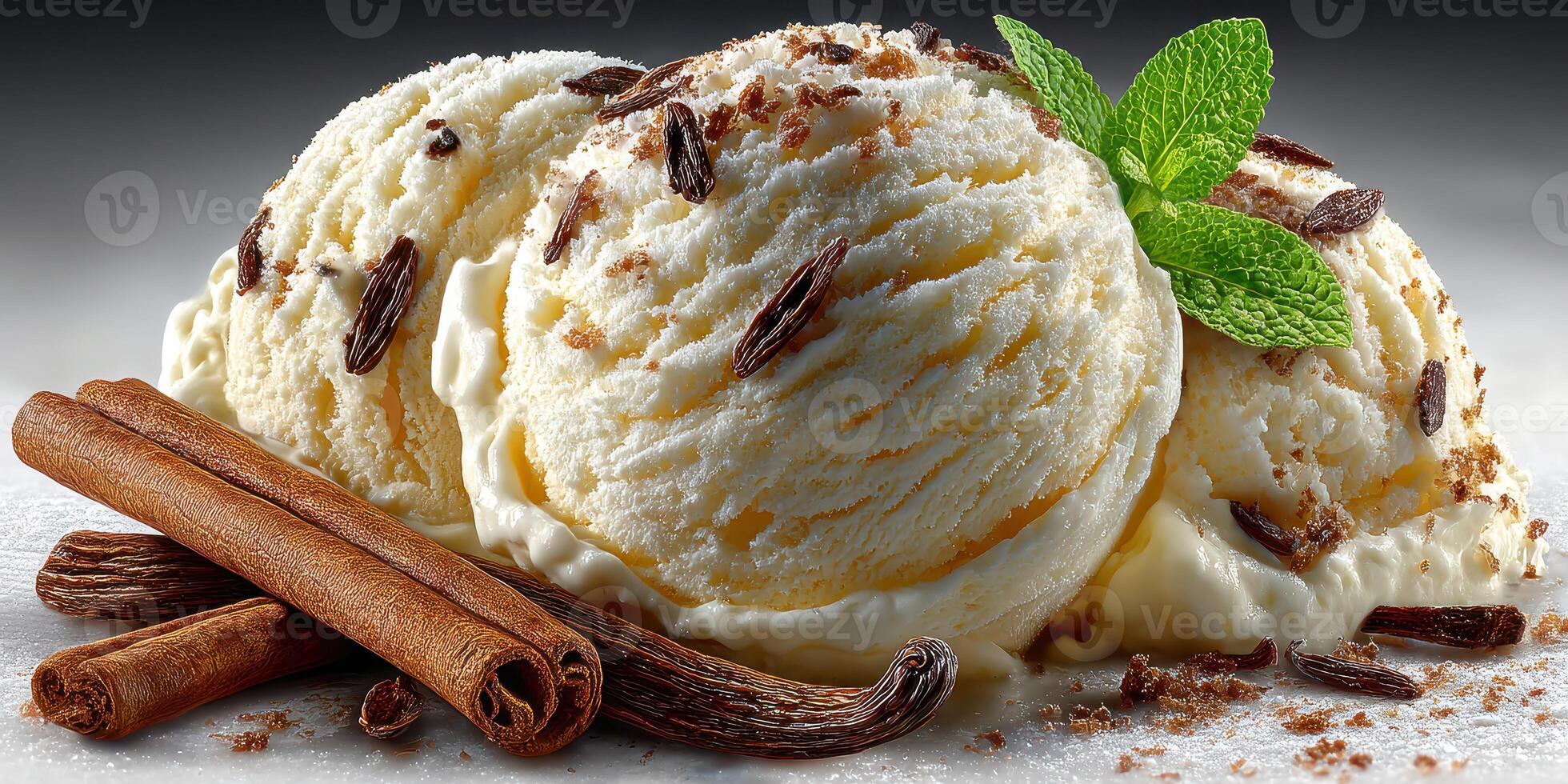 Delicious vanilla ice cream topped with chocolate shavings and fresh mint served with cinnamon sticks photo