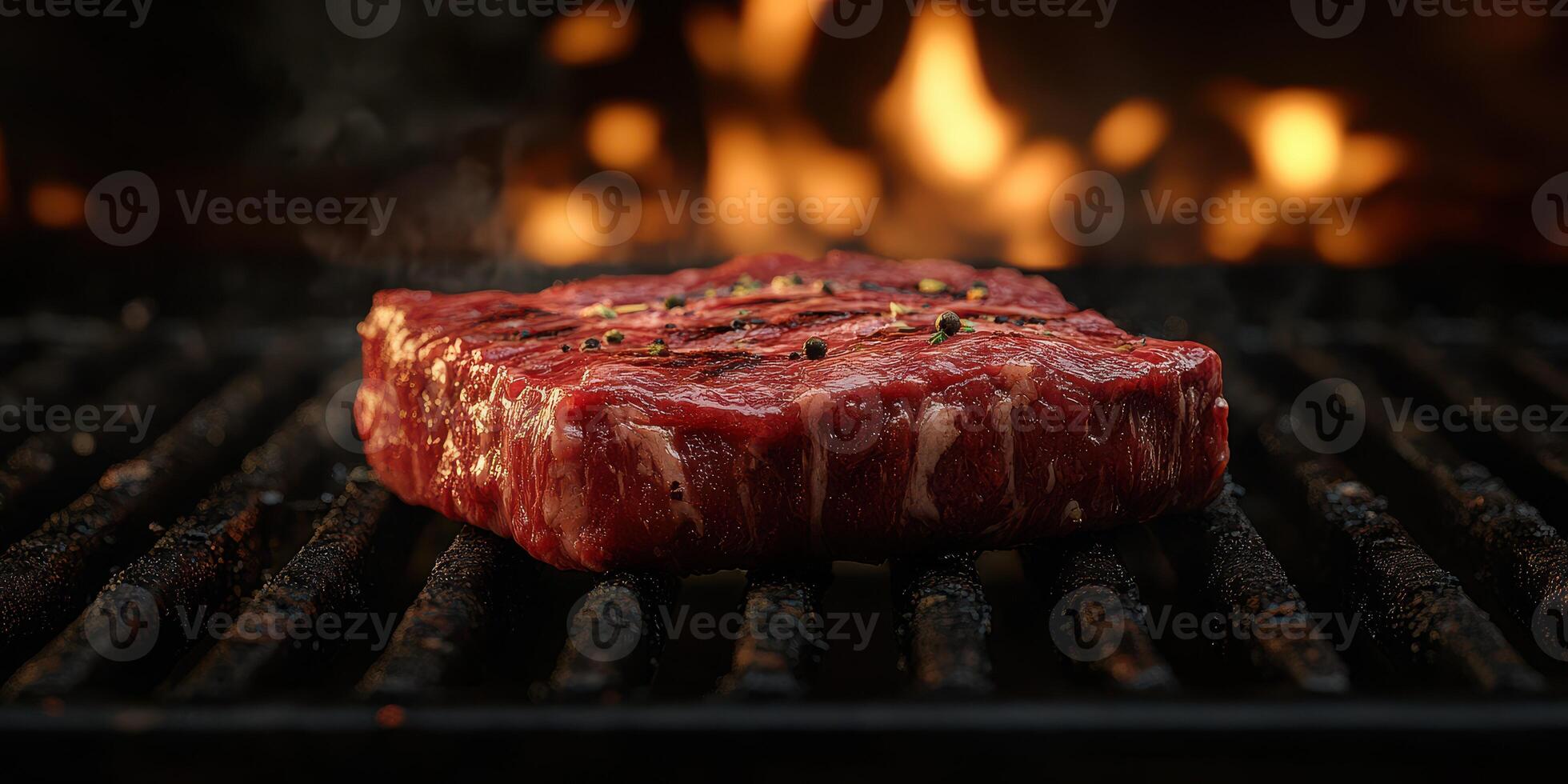 Grilling a juicy steak on the barbecue during a summer evening cookout photo