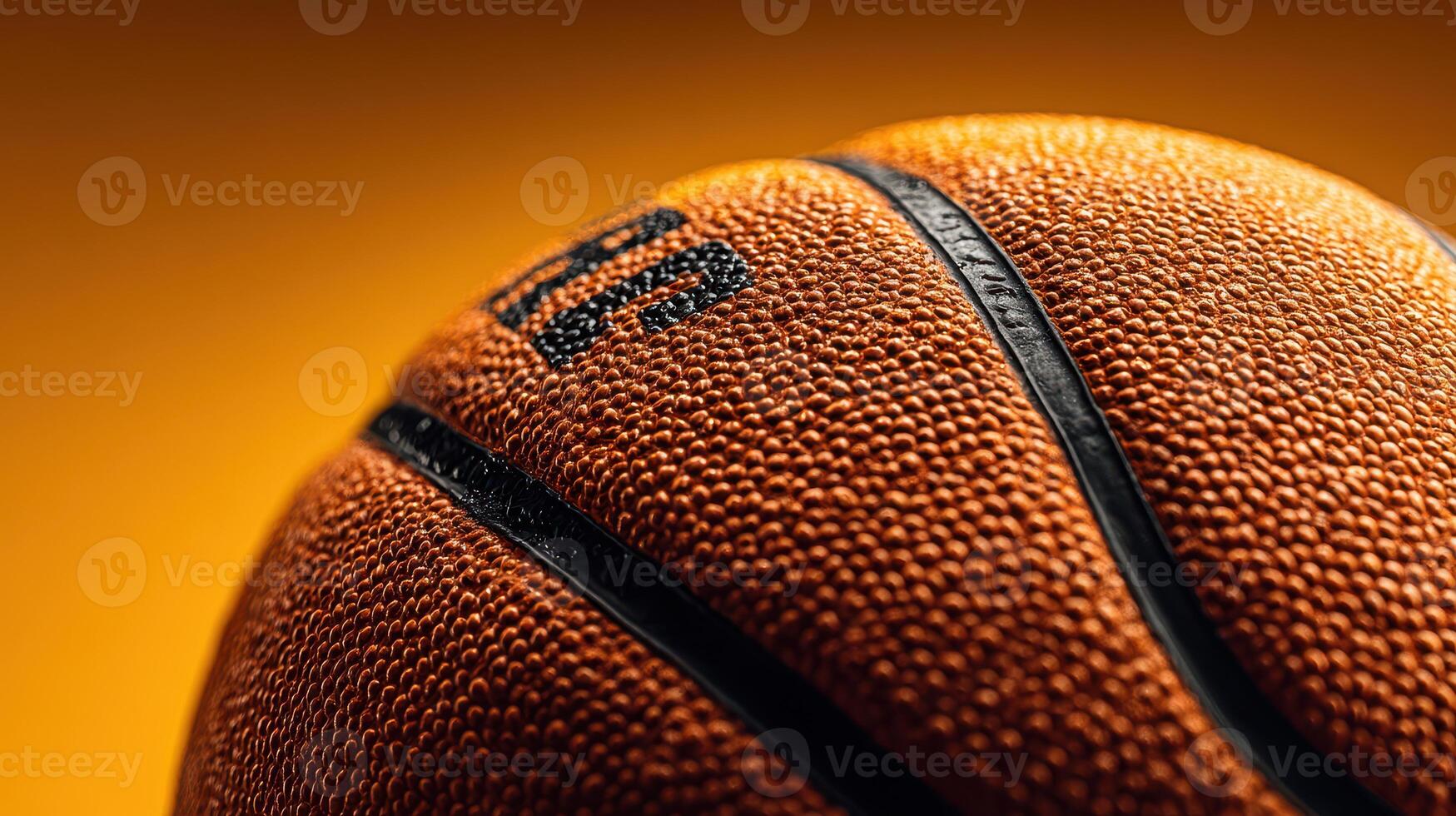 Close-up shot of a basketball against a vibrant orange background highlighting texture and detail in an indoor setting photo