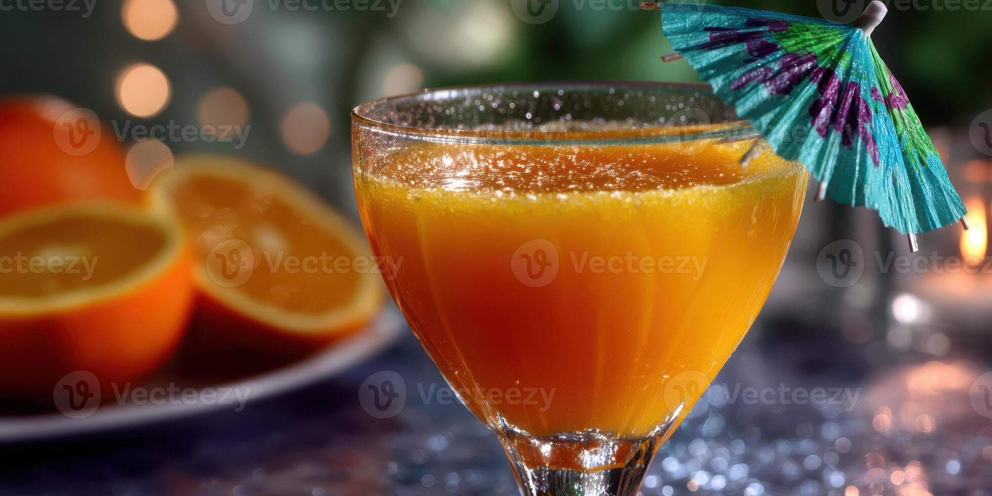 Colorful tropical cocktail served in a glass with a decorative umbrella and fresh orange slices on the side photo