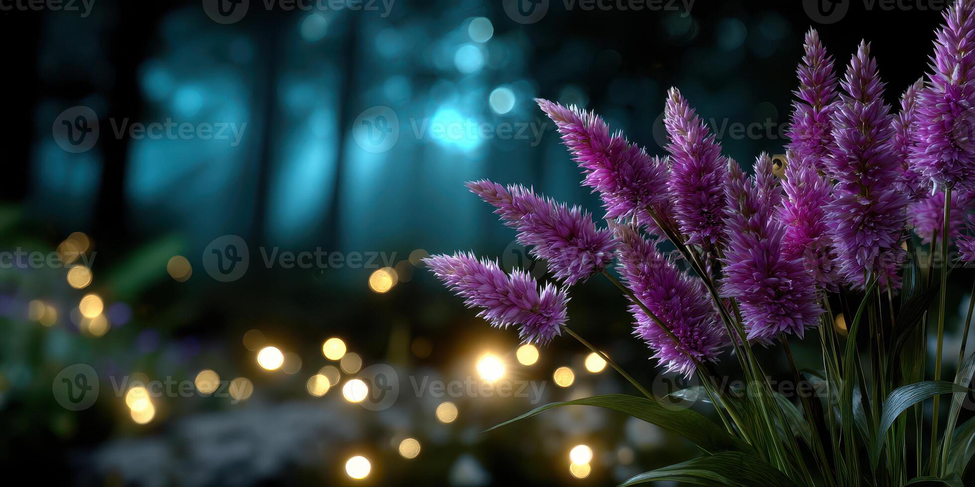 Vibrant purple flowers illuminated by soft light in a serene forest at night photo