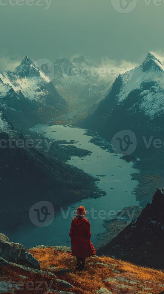 Stunning mountain landscape with a solitary figure gazing at a winding river during twilight in a serene location photo