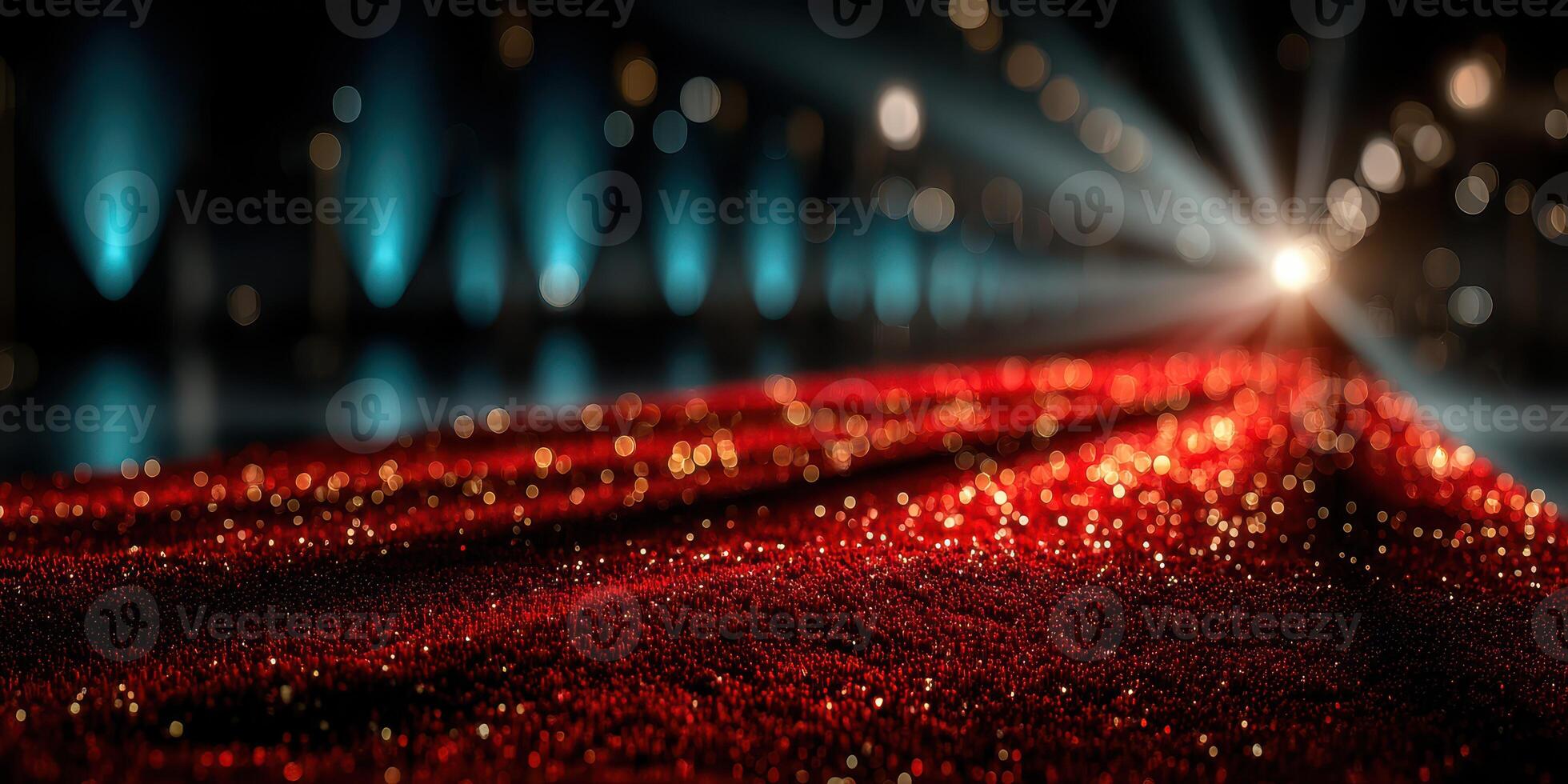 Glamorous red carpet leading to bright lights in a festive setting during an evening event photo