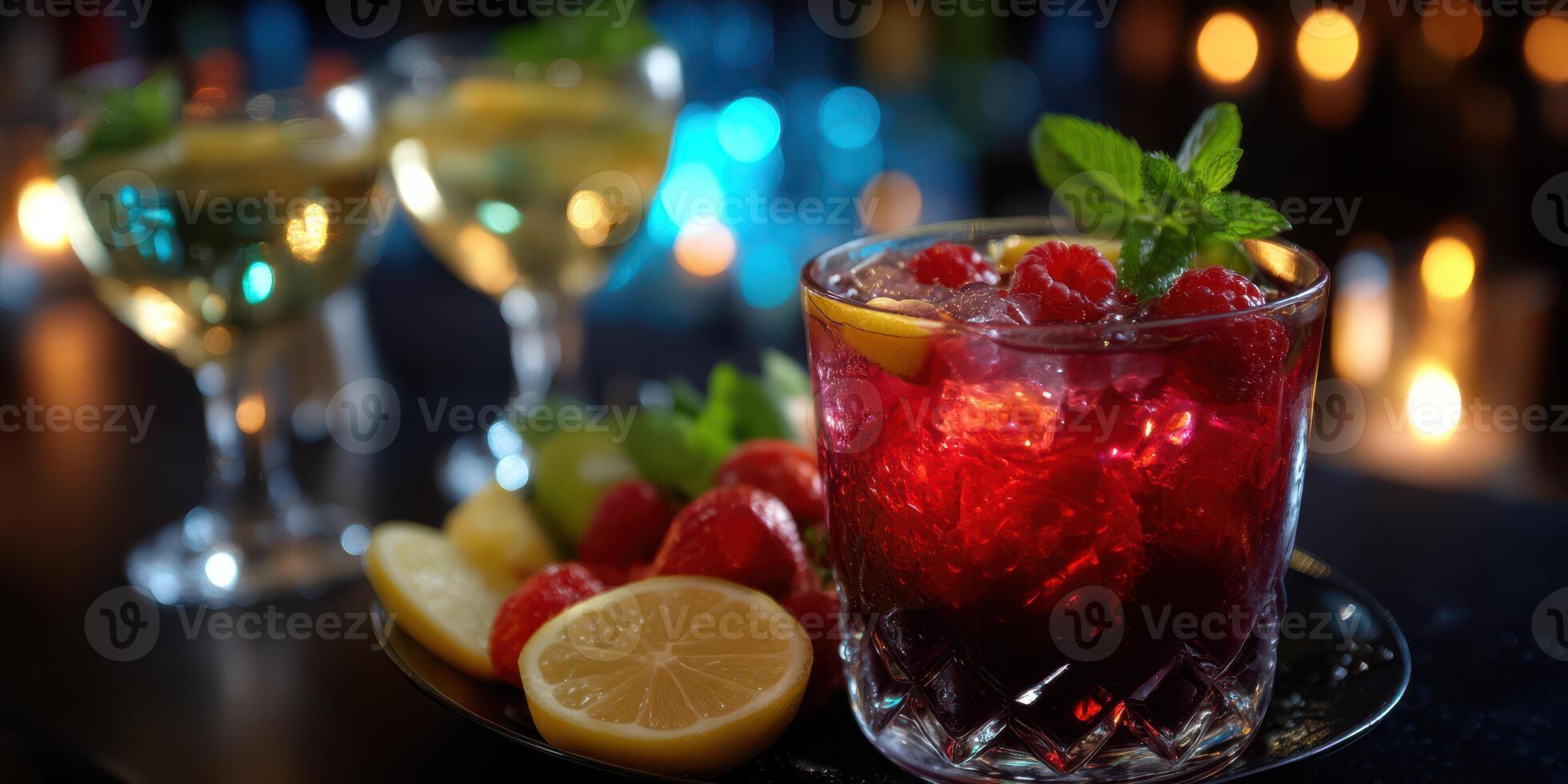 Vibrant cocktails garnished with fresh fruits served at an evening gathering photo