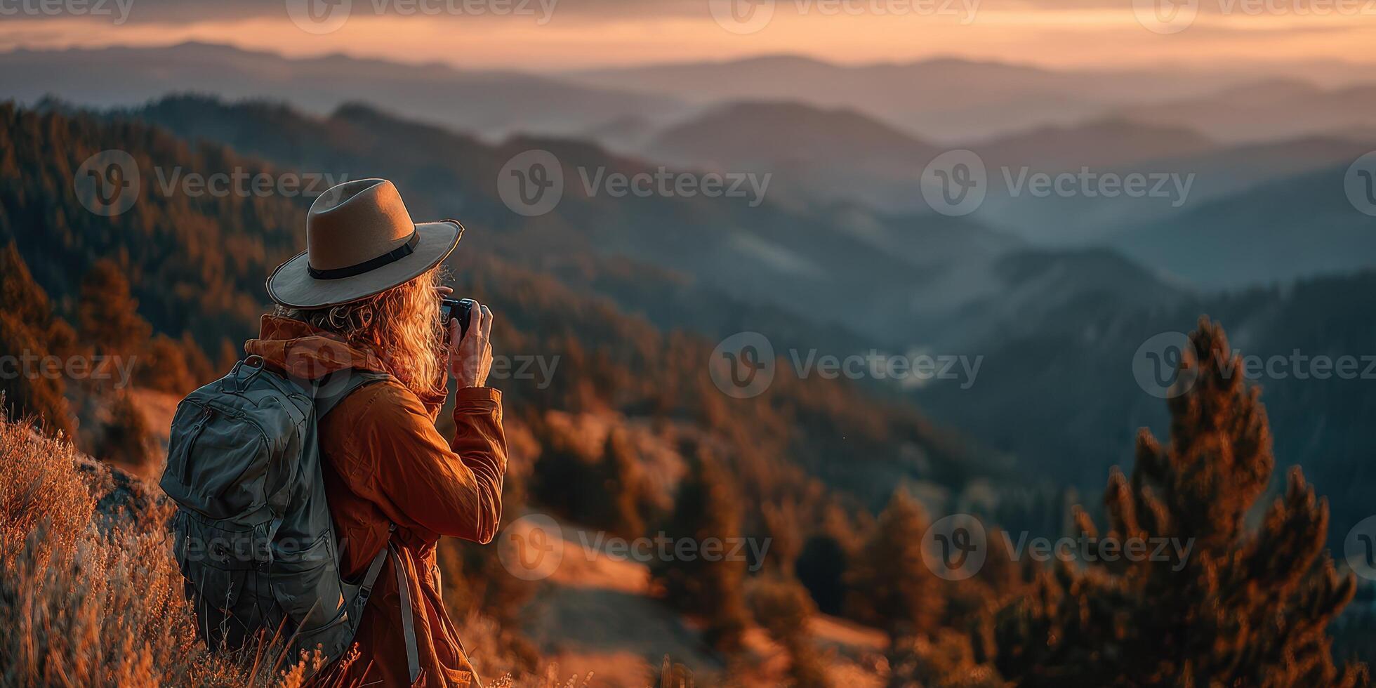 Enjoying nature while capturing sunset moments in the mountains photo