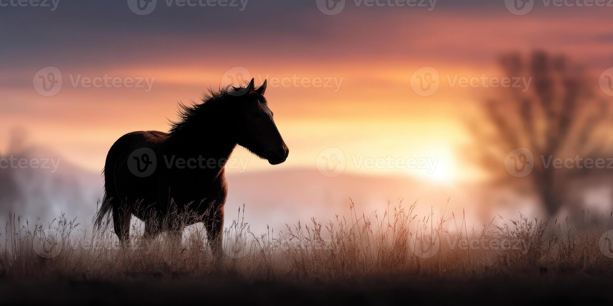 Majestic horse stands silhouetted against a vibrant sunset in a tranquil open field photo