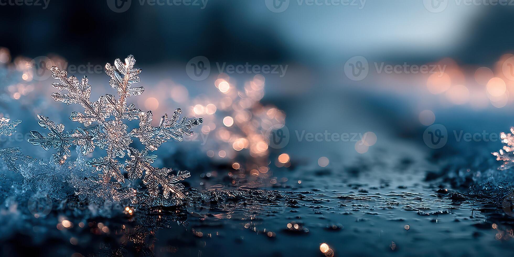 Snowflakes glisten on wet pavement during twilight as soft lights twinkle in the background creating a winter atmosphere photo