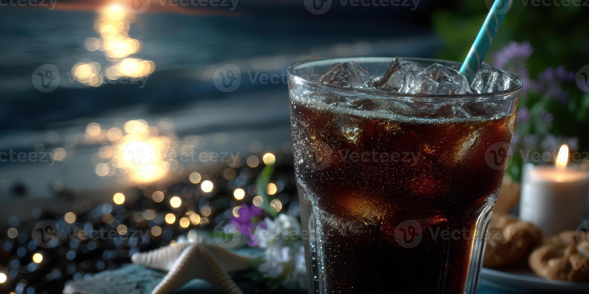 Enjoying a refreshing cold drink by the seaside during sunset with stars shining on the water photo