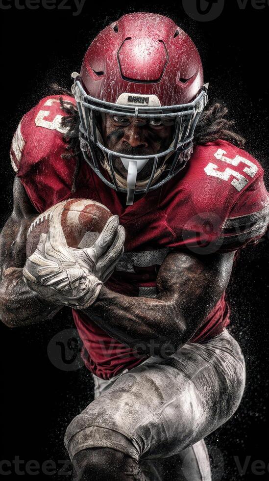 Muscular football player running with ball during game under stadium lights creating dramatic dust clouds photo