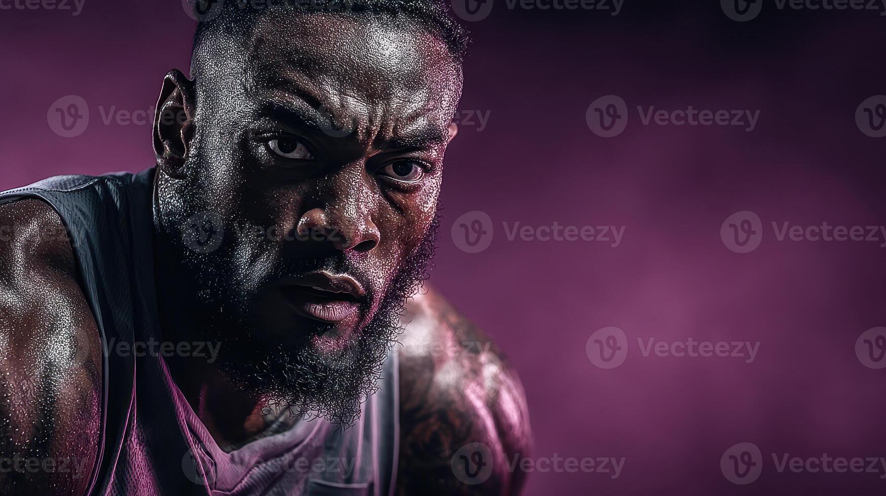 Intense athlete focused during training session in dramatic lighting at gym photo