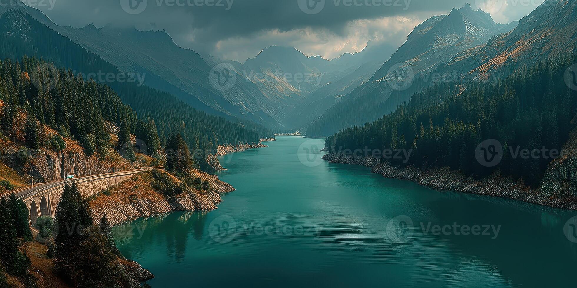 Scenic view of a tranquil mountain lake surrounded by dense forests and towering peaks in late afternoon light photo