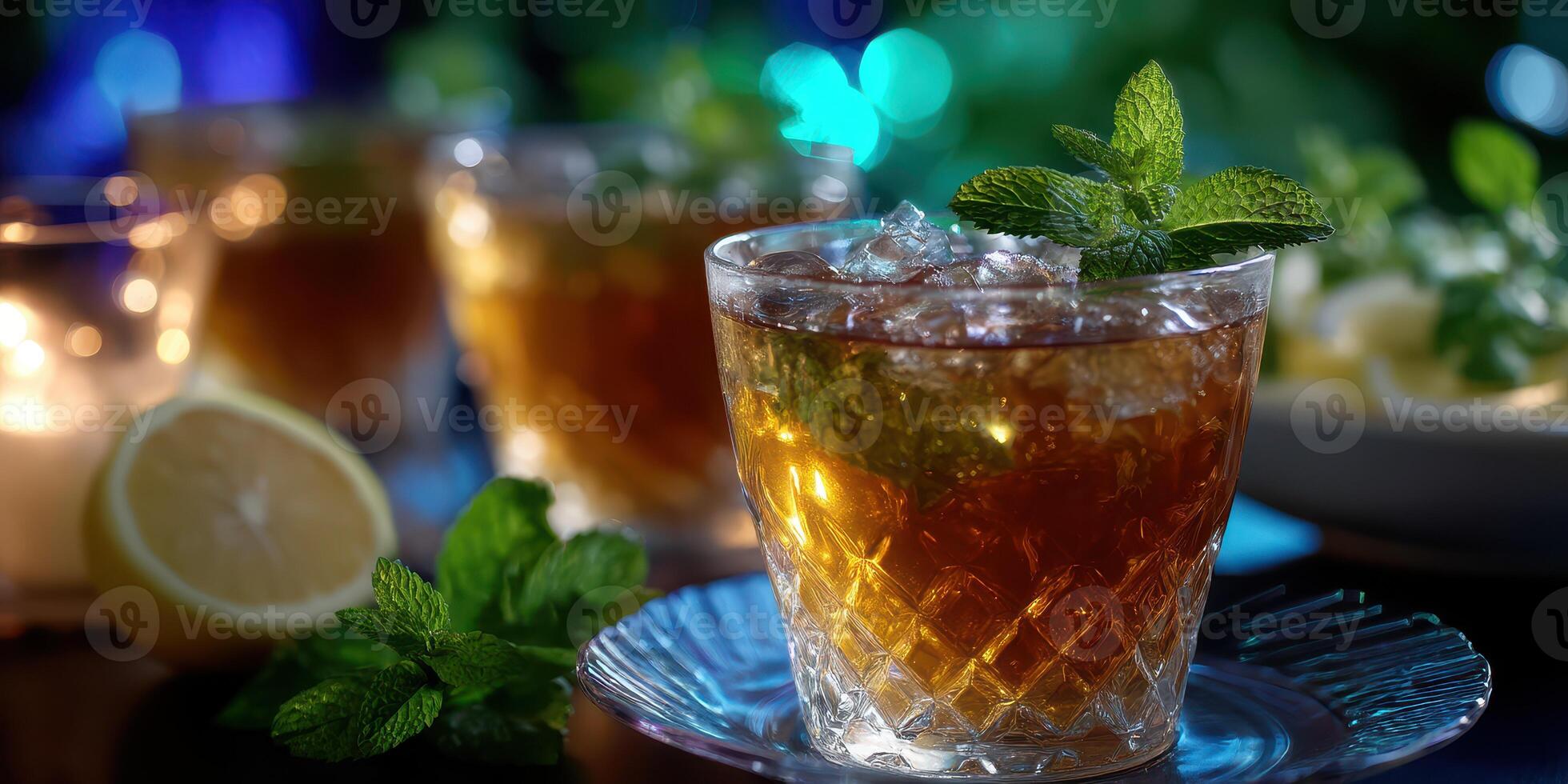 Refreshing mint iced tea garnished with fresh mint leaves and lemon slices in a cozy evening setting photo