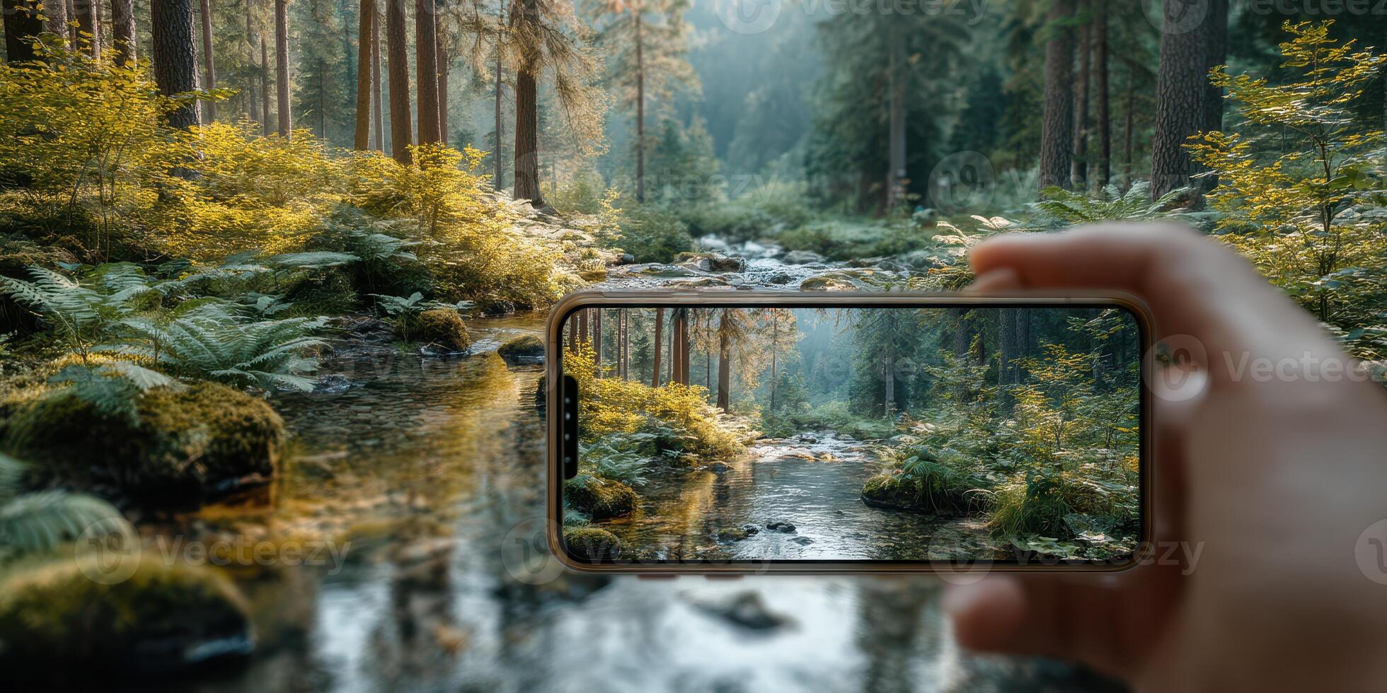 Capturing nature's beauty through a smartphone in a peaceful forest stream on a sunny afternoon photo