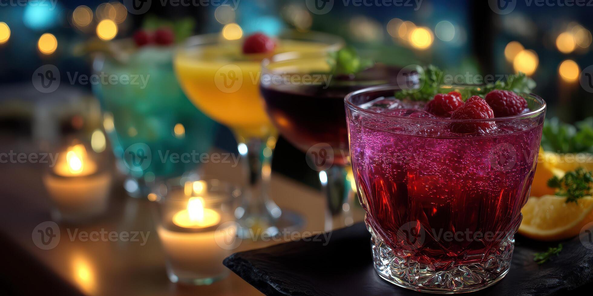 Colorful cocktails served on a bar table with candlelight and city lights in the background during a vibrant evening gathering photo