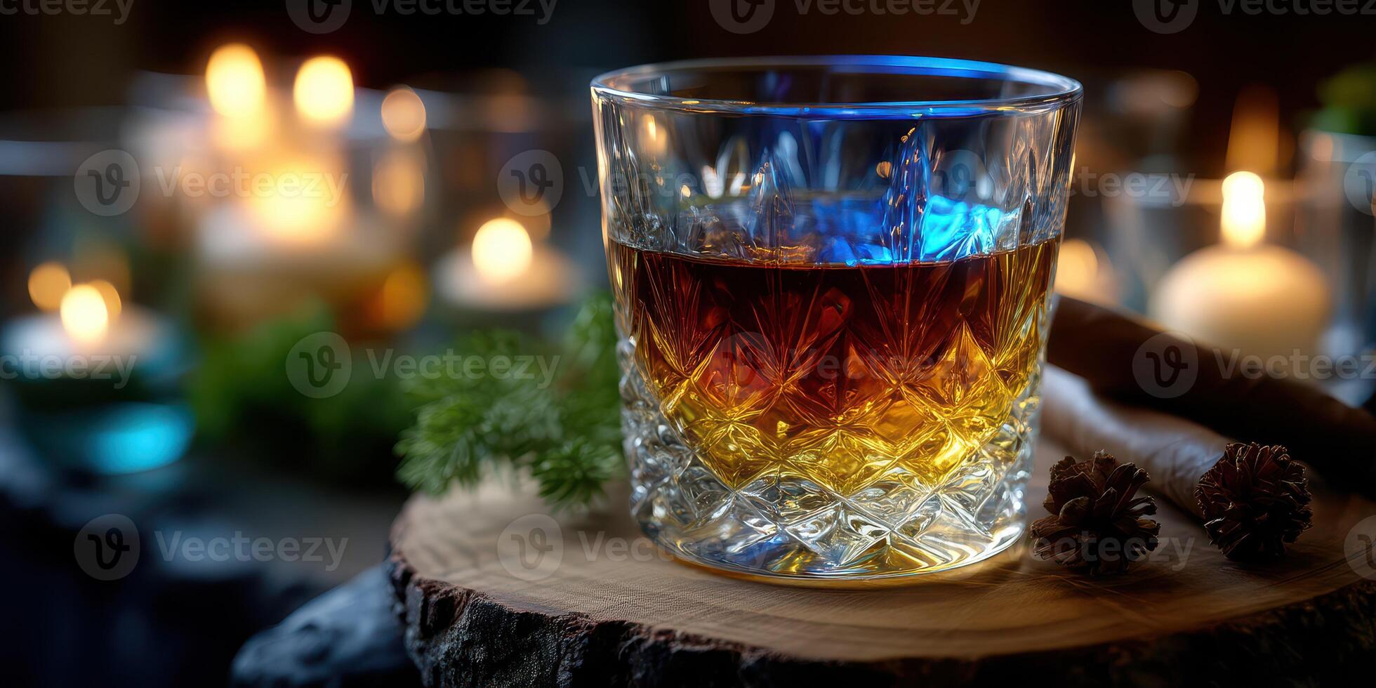 Warm atmosphere of whiskey served in a crystal glass with candles and nature elements around in a cozy setting photo