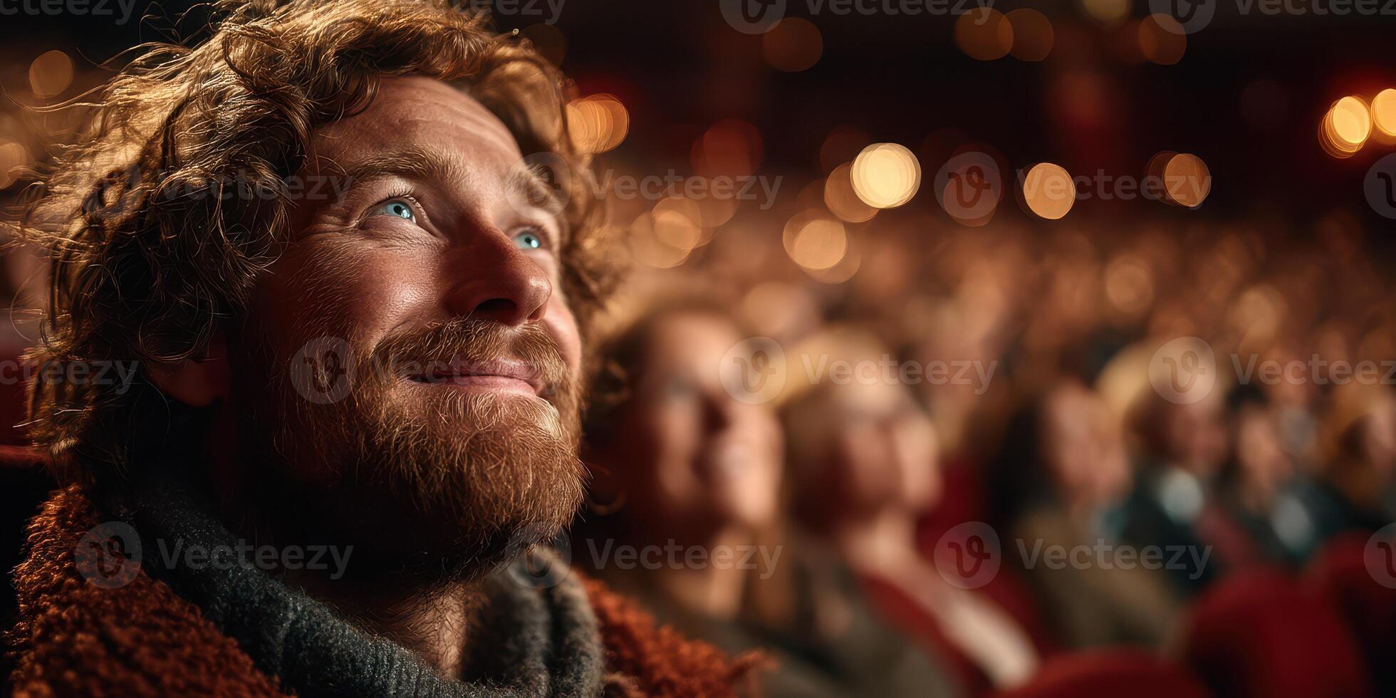 Audience member enjoys performance with deep emotion in a packed theater during a live event photo
