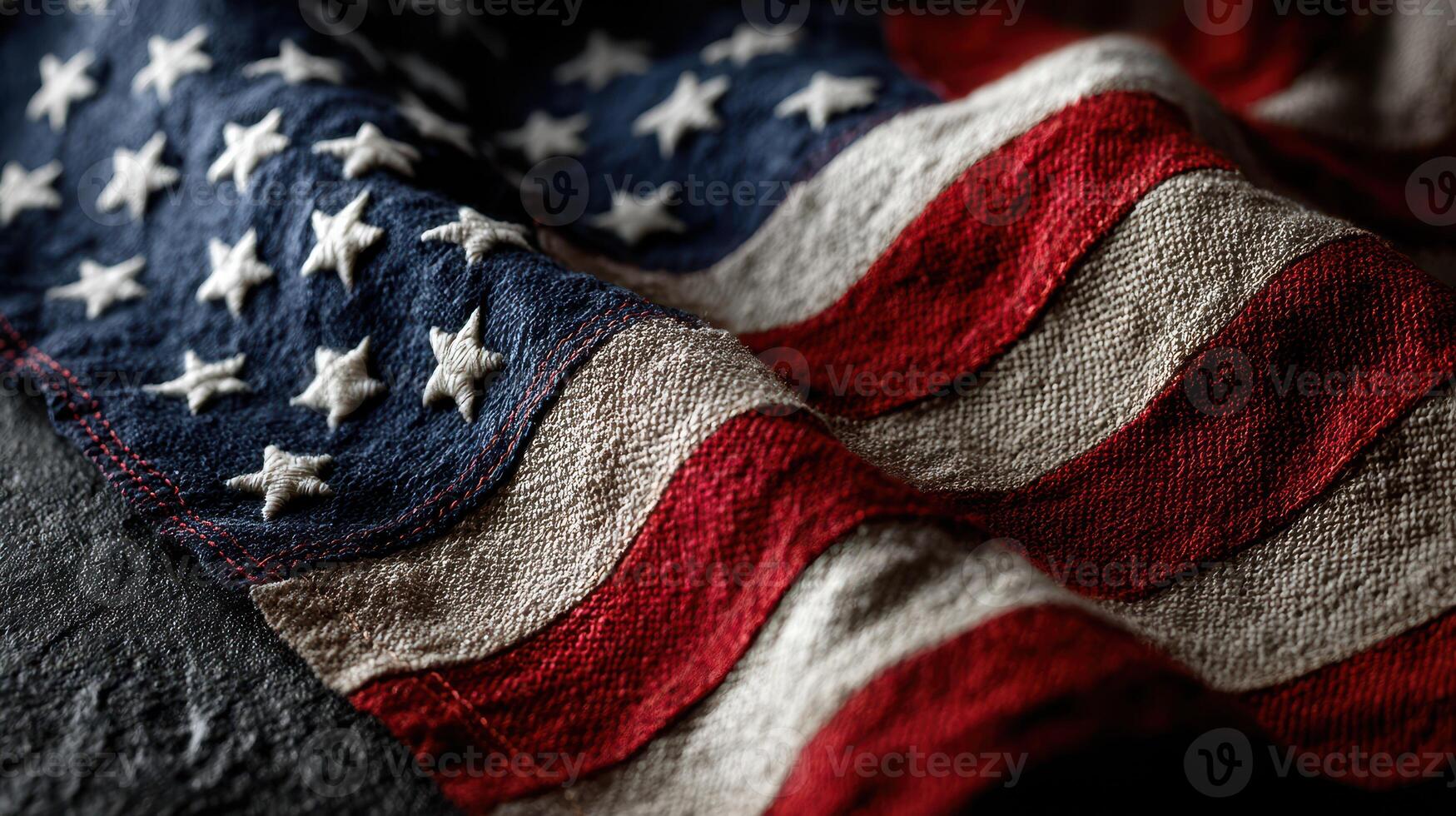 Close-up view of a weathered American flag gently waving in a soft breeze during daylight hours photo