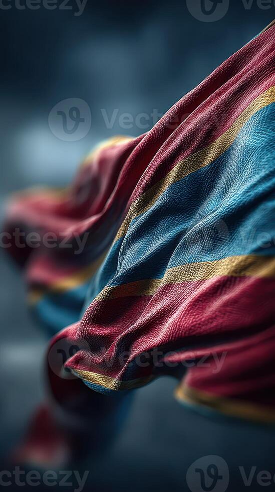 Colorful fabric waving in the wind with striking blue and red stripes creating an elegant texture photo