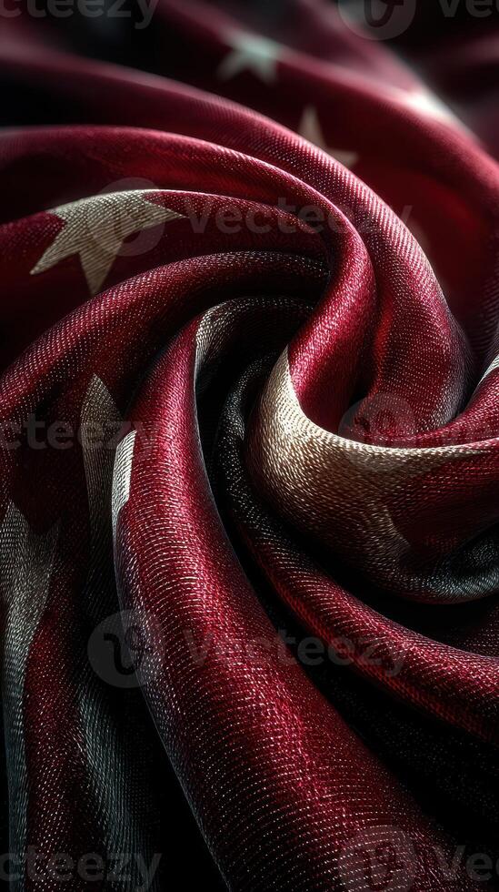 Close-up of a swirling fabric featuring a vibrant red, white, and blue pattern with stars and stripes photo