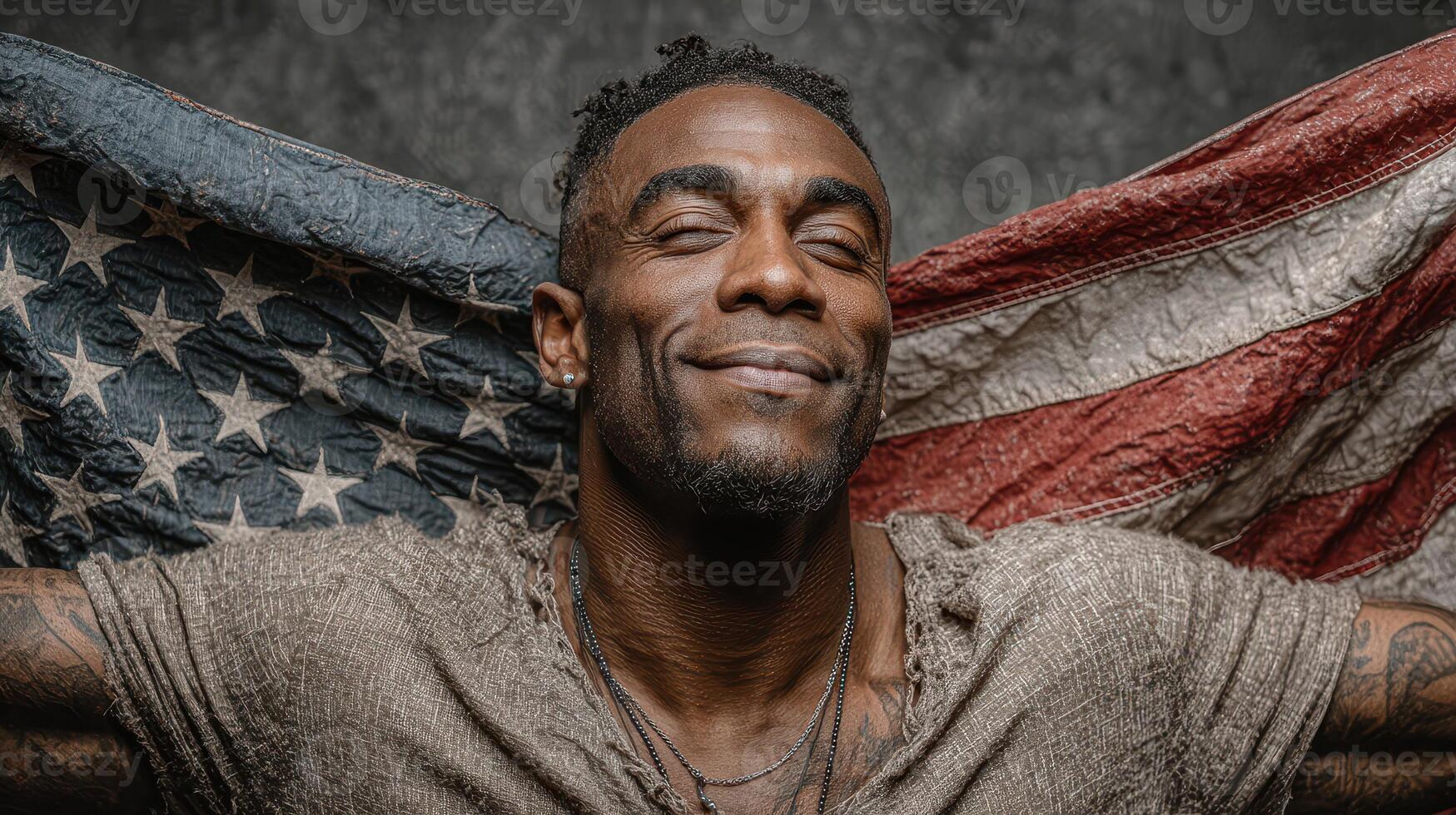 Smiling man joyfully holding an American flag in a studio setting during a vibrant portrait session photo