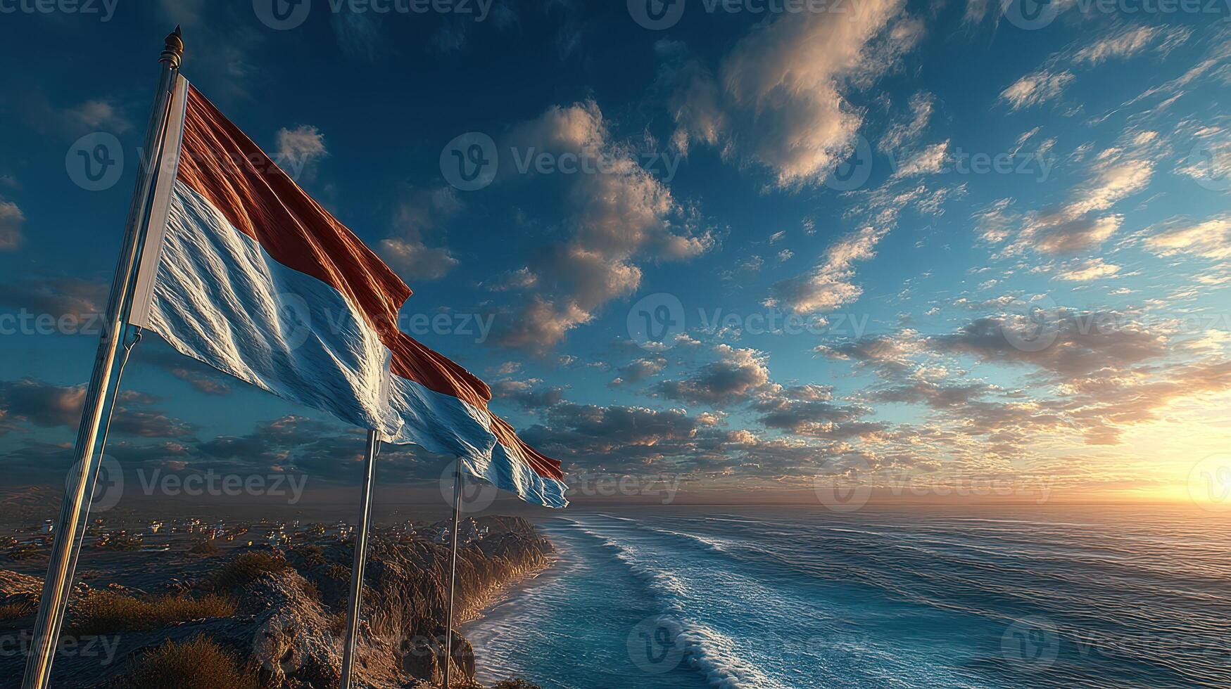 Waves crash against the shore as colorful flags flutter in the vibrant sunset sky by the coastline photo